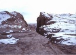 Hole-in-the-Rock crevice opening -- winter conditions similar to conditions experienced by the pioneers as they worked on the road through the crevice. Lamont Crabtree Photo  